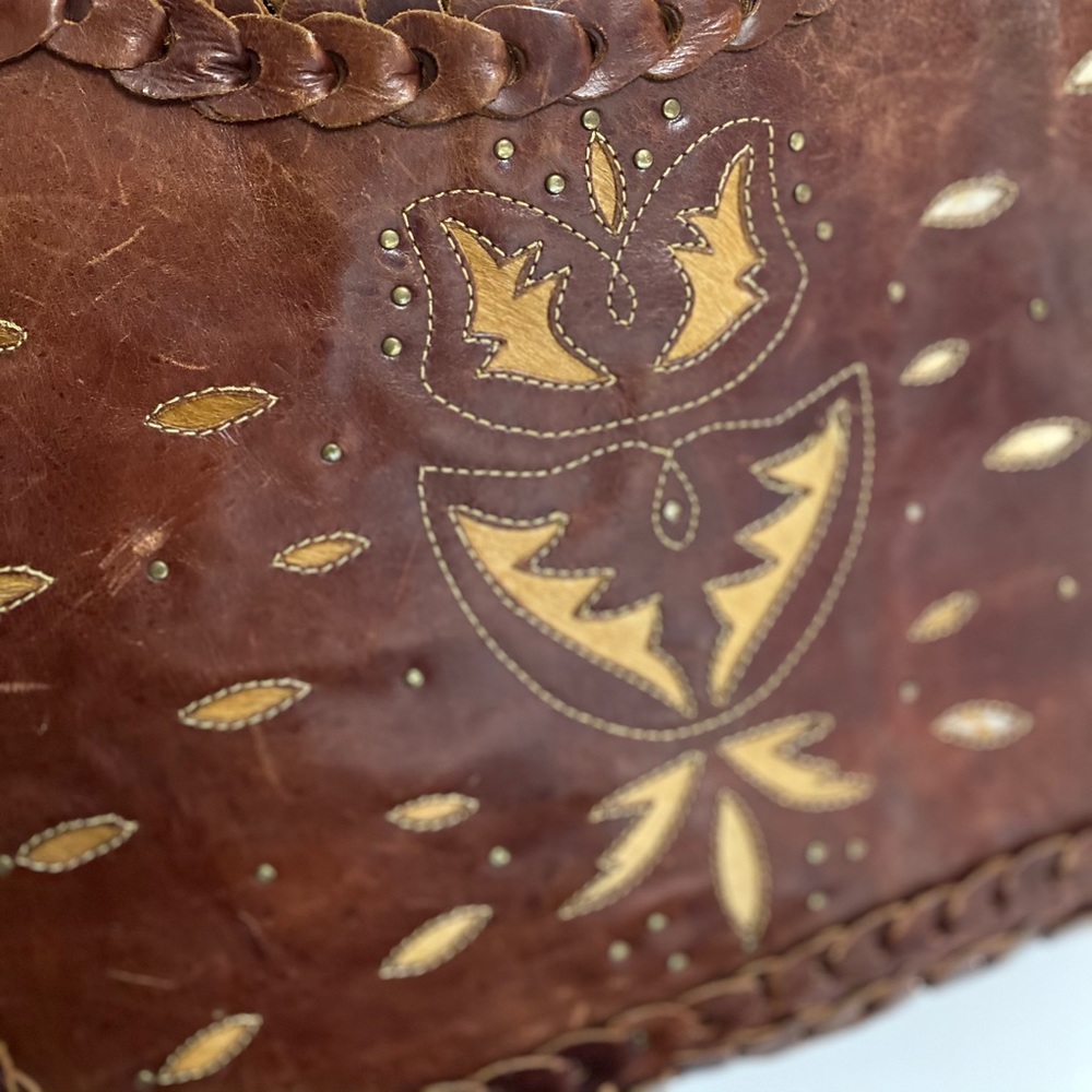 Leather purse with intricate cowhide designs